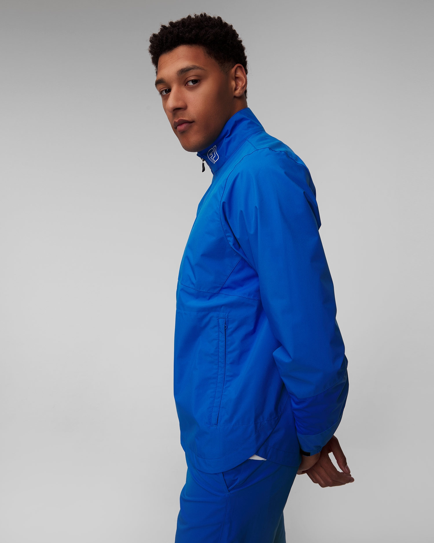 Světle modrá pánská nepromokavá bunda FootJoy Eu HydroLite X