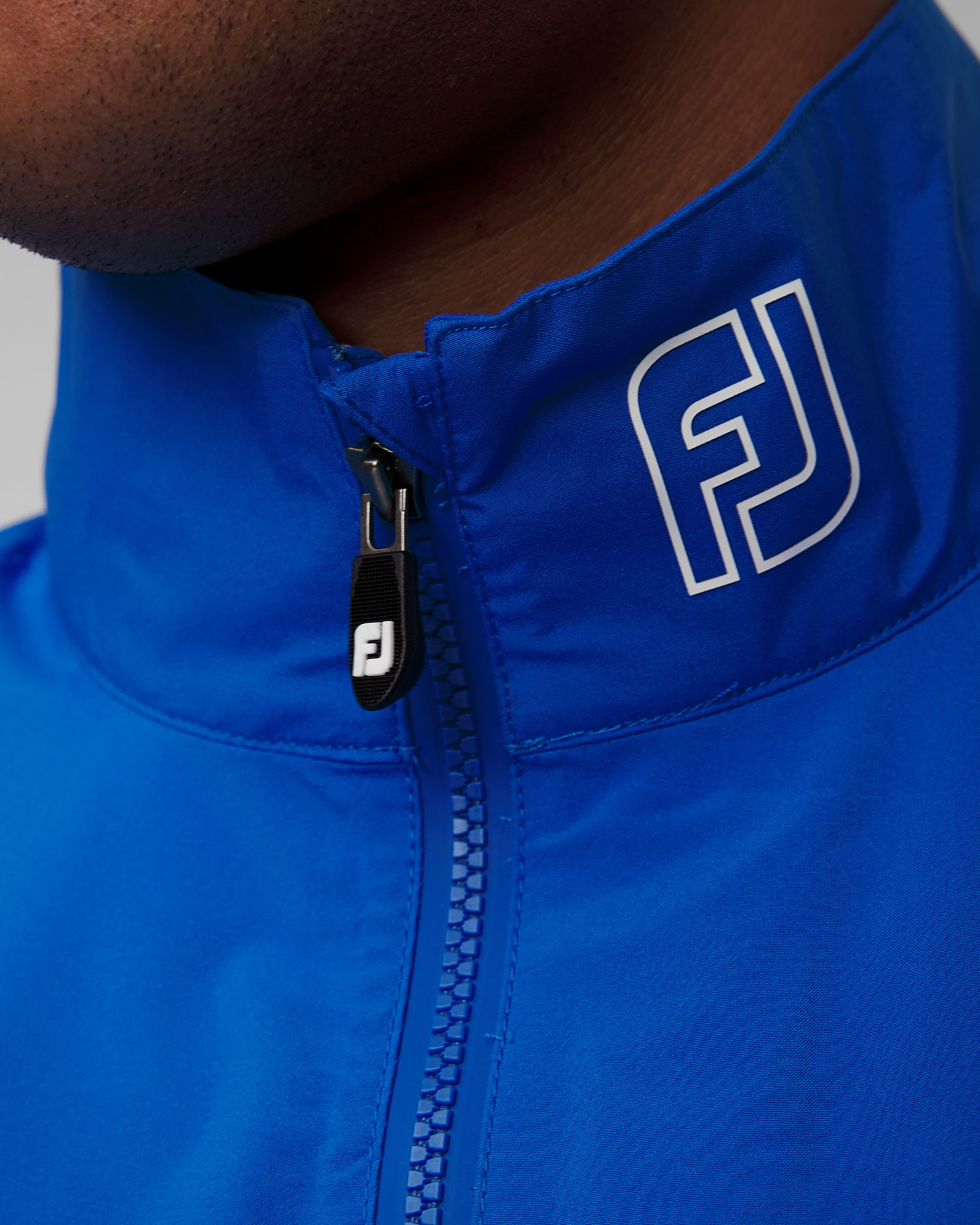 Světle modrá pánská nepromokavá bunda FootJoy Eu HydroLite X