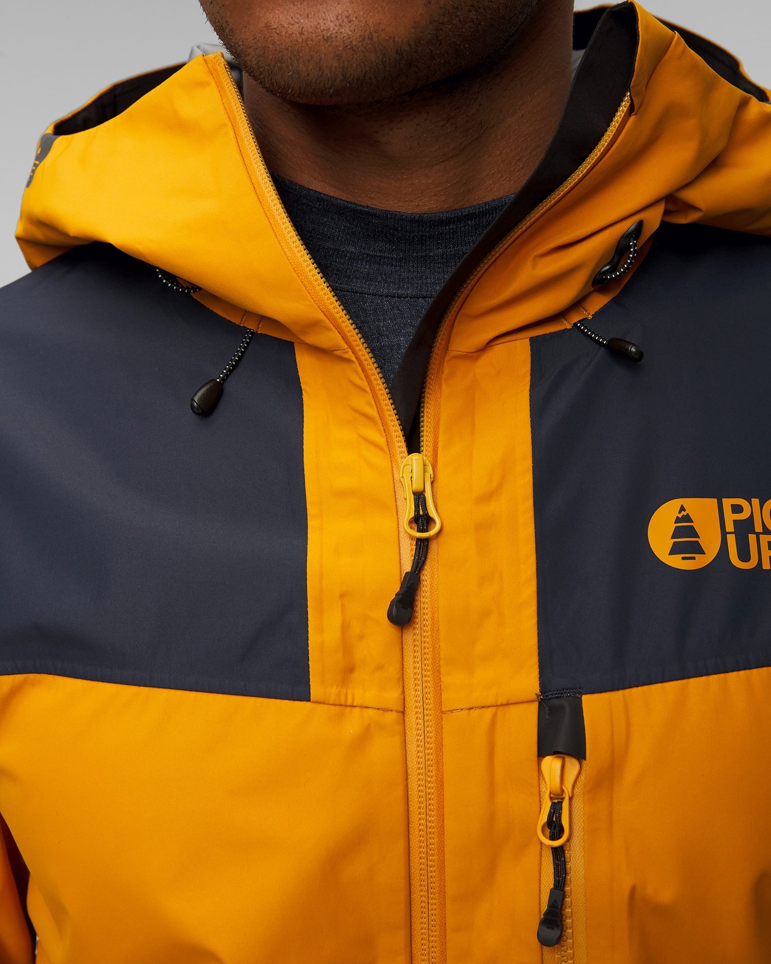 Pánská hardshellová zimní lyžařská bunda Picture Organic Clothing Broader 3L 20/20 v Tmavě Modrém a Oranžovém Barevném Odstínu